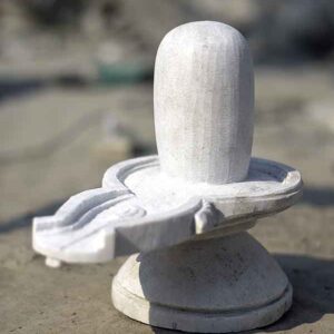 Unpolished Shiva-linga made of white marble.